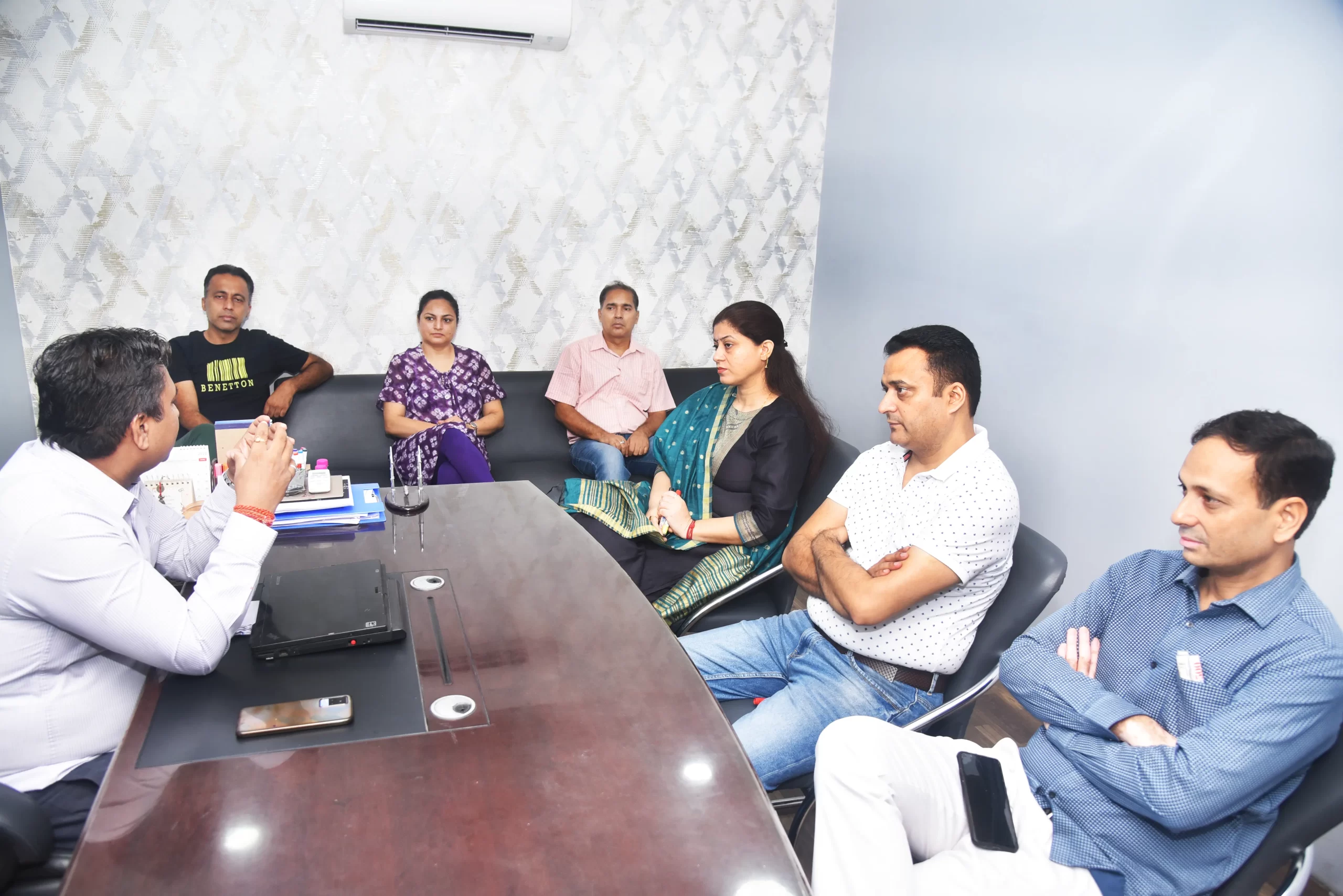 Image showcasing a teachers' meeting.